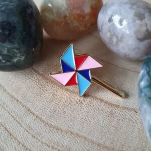 90s nostalgia pin featuring a colorful retro pinwheel design with gold plating.