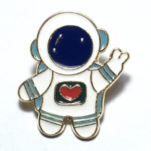 Astronaut heart enamel pin featuring a white space suit, blue visor, and a red heart detail.