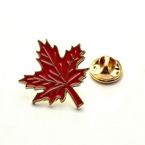 Detailed red maple leaf lapel pin featuring intricate gold veining and a high-gloss finish.