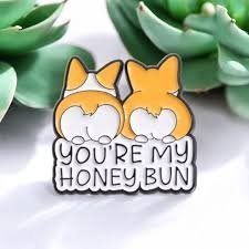 Corgi honey bun pin with detailed black nickel plating and dual Corgi design.