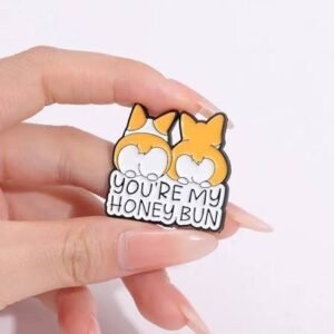 Corgi honey bun pin featuring two round Corgi butts and cute typography.