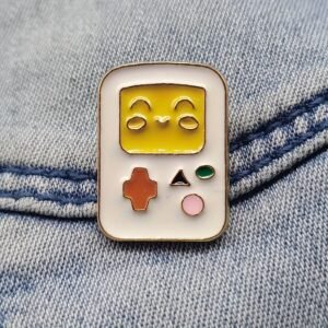 Gamer gifts enamel pin styled on a denim jacket for a 90s retro gaming aesthetic.