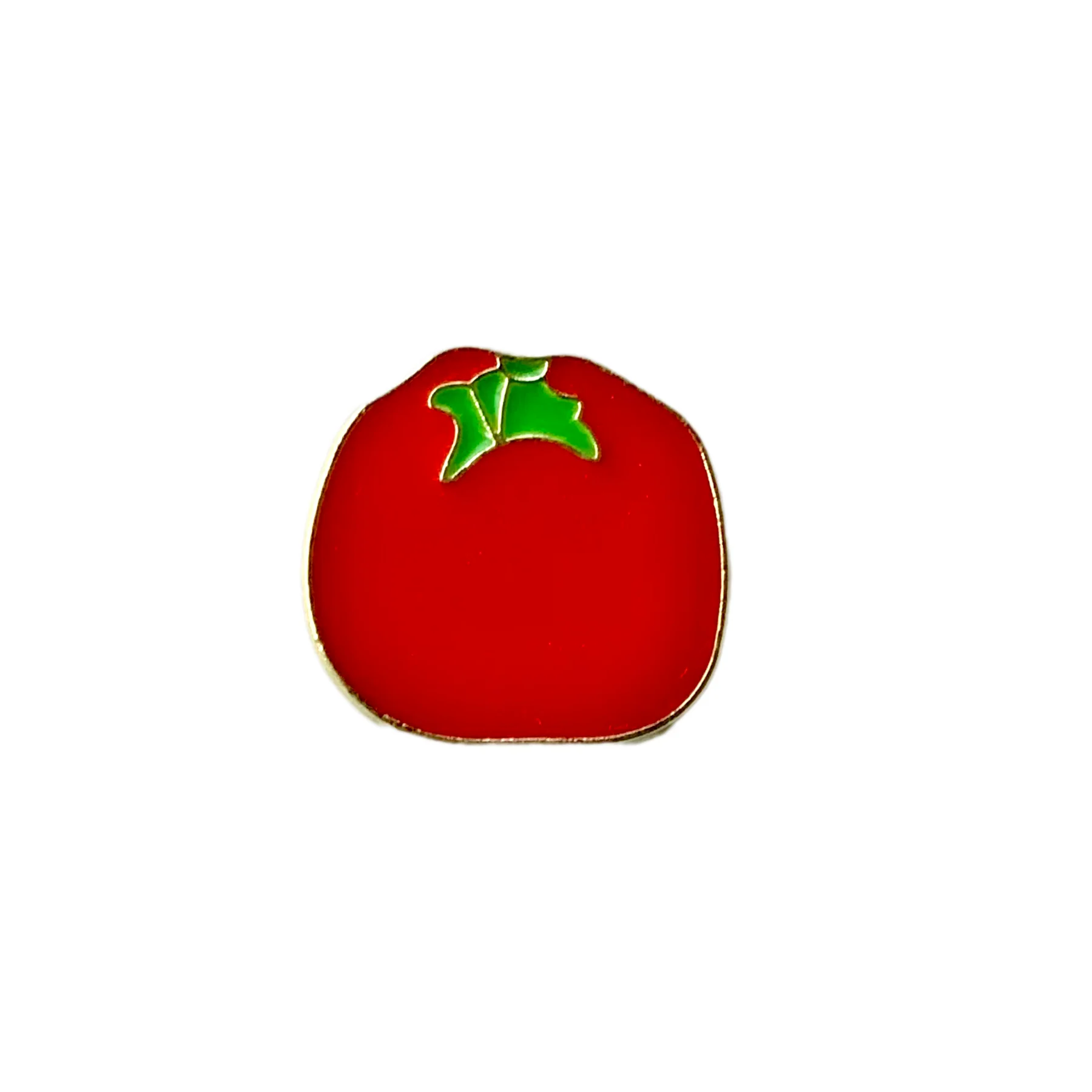 Bright red tomato enamel pin with a green stem and polished gold-plated finish.