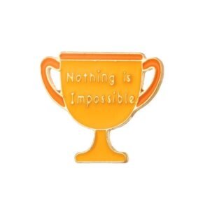 A gold-colored trophy cup enamel pin with orange filling and the motivational phrase "Nothing is Impossible" written in white lettering.