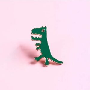 Tiny green Tyrannosaurus Rex enamel pin in a walking pose with gold-plated metal outline.
