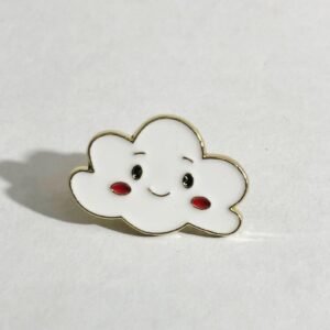 A cute white cloud enamel pin with a smiling face and red rosy cheeks, outlined in gold.