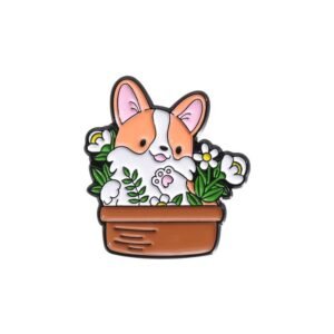 A cute Corgi puppy enamel pin sitting inside a terracotta flower pot surrounded by white daisies and green leaves.