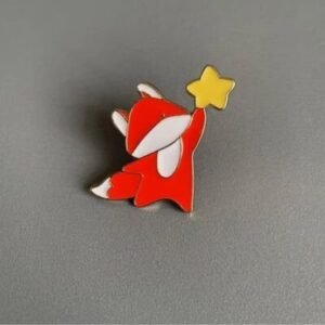 A small red and white fox enamel pin reaching upward to touch a bright yellow five-pointed star.