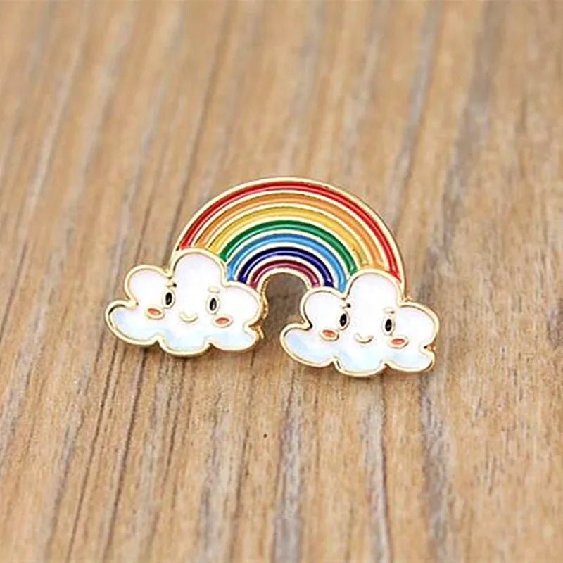 Rainbow clouds enamel pin featuring two cute smiling clouds.