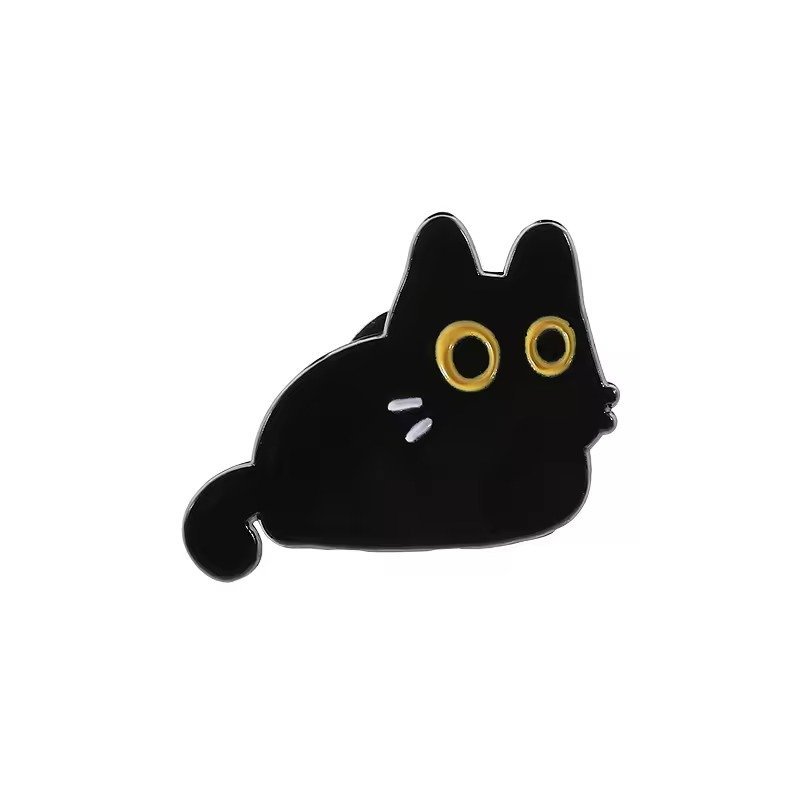 Round black cat enamel pin with large yellow eyes and white whiskers.