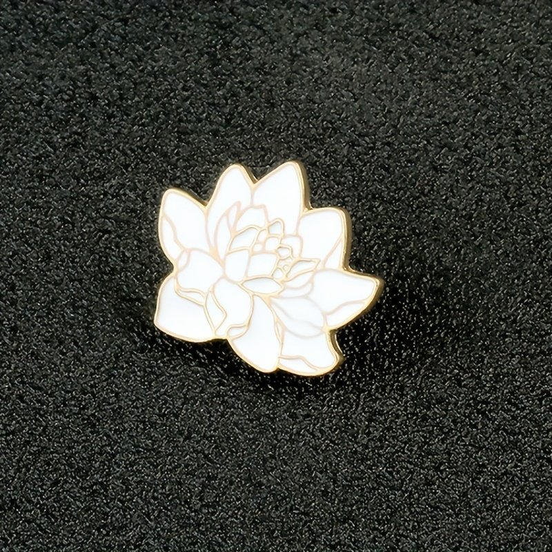 A high-quality white lotus flower pin featuring detailed gold metal petal outlines.