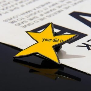 Your did it enamel pin reflecting on a glossy surface.