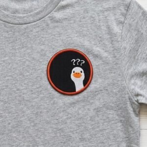 Confused goose patch on a grey t-shirt