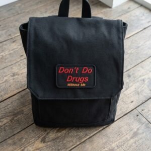 Don't Do Drugs Without Me patch on a black canvas backpack flap