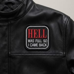 Hell Was Full So I Came Back patch with red gothic text on a black leather jacket