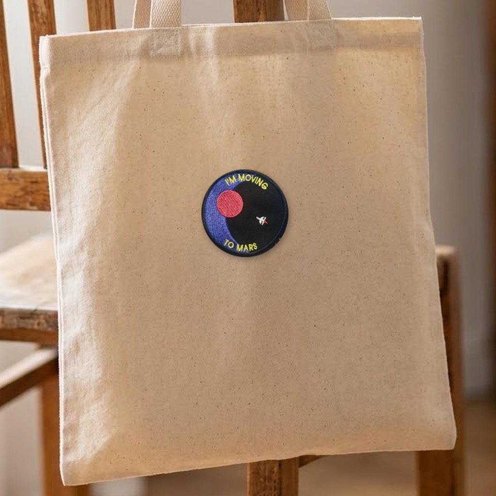 I'm Moving To Mars patch on a canvas tote bag