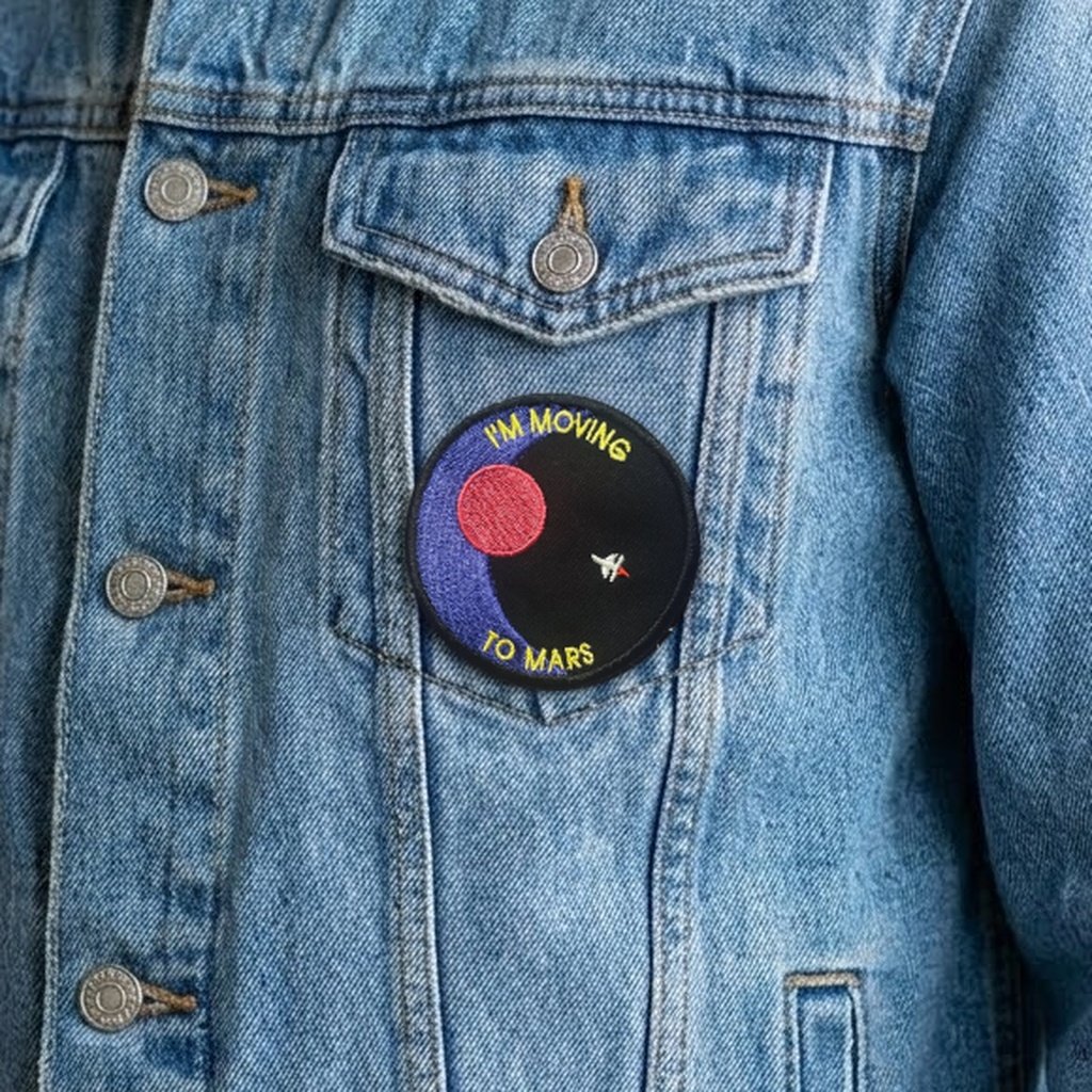 I'm Moving To Mars patch on a denim jacket pocket