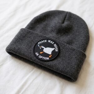 Peace Was Never An Option goose patch on a grey knitted beanie